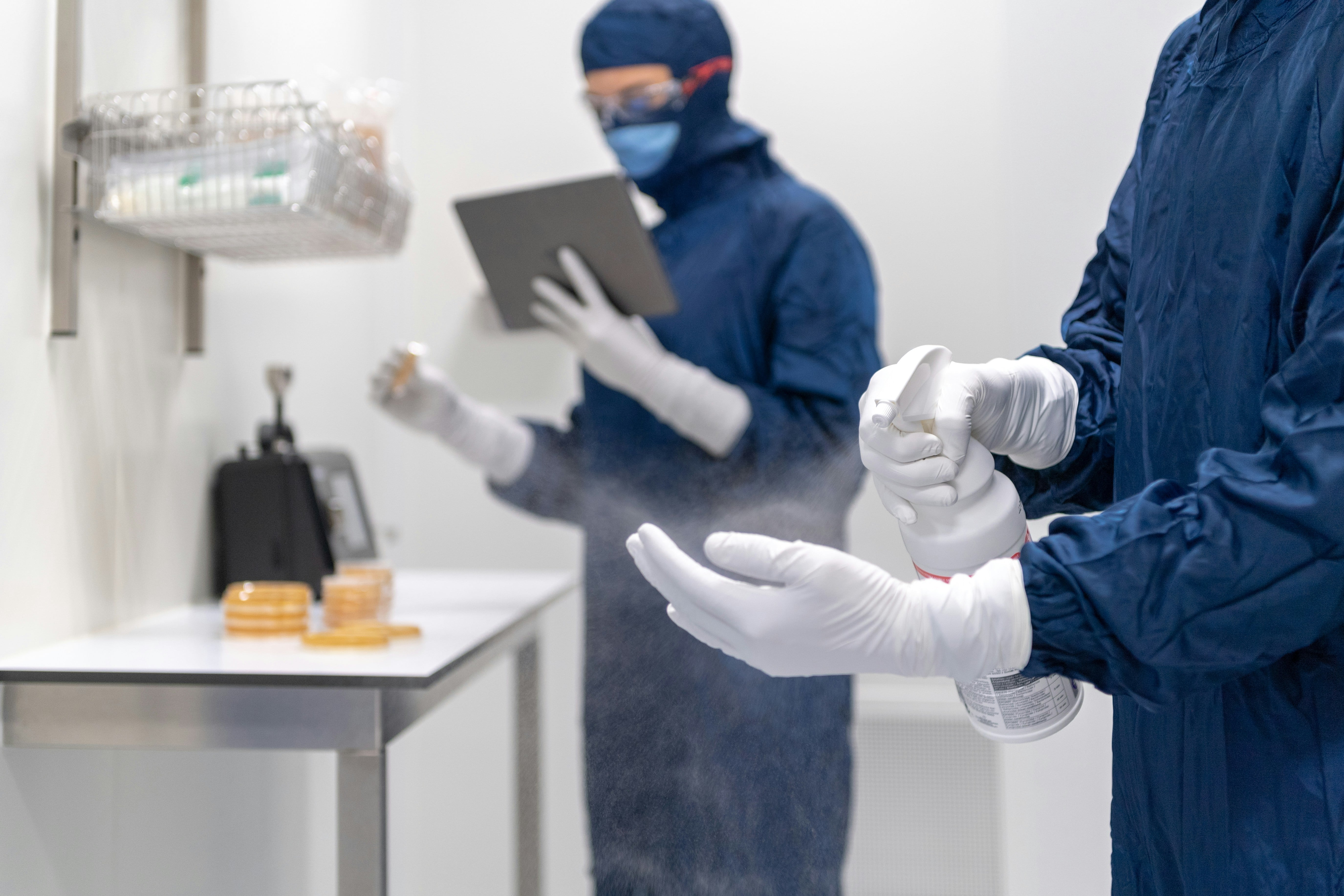 PHOENIX expert carefully sanitizing and inspecting clinical trial materials, highlighting the company's dedication to GMP Compliant Drug Disposal Services and the safety of healthcare environments.